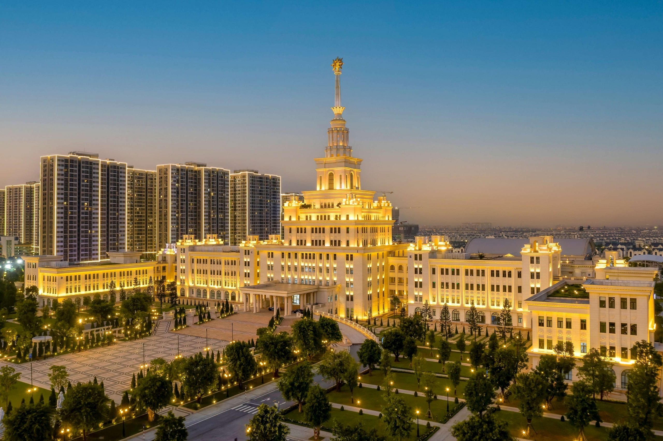 VinUniversity's illuminated campus and central tower at dusk